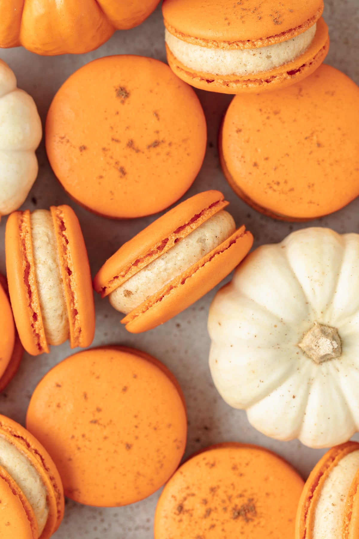 super close up of orange pumpkin macarons