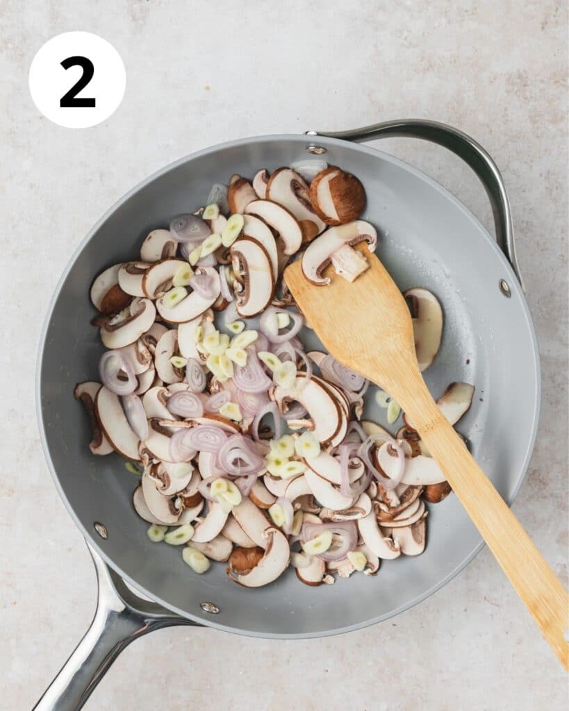 sauteeing mushrooms shallots and garlic in pan