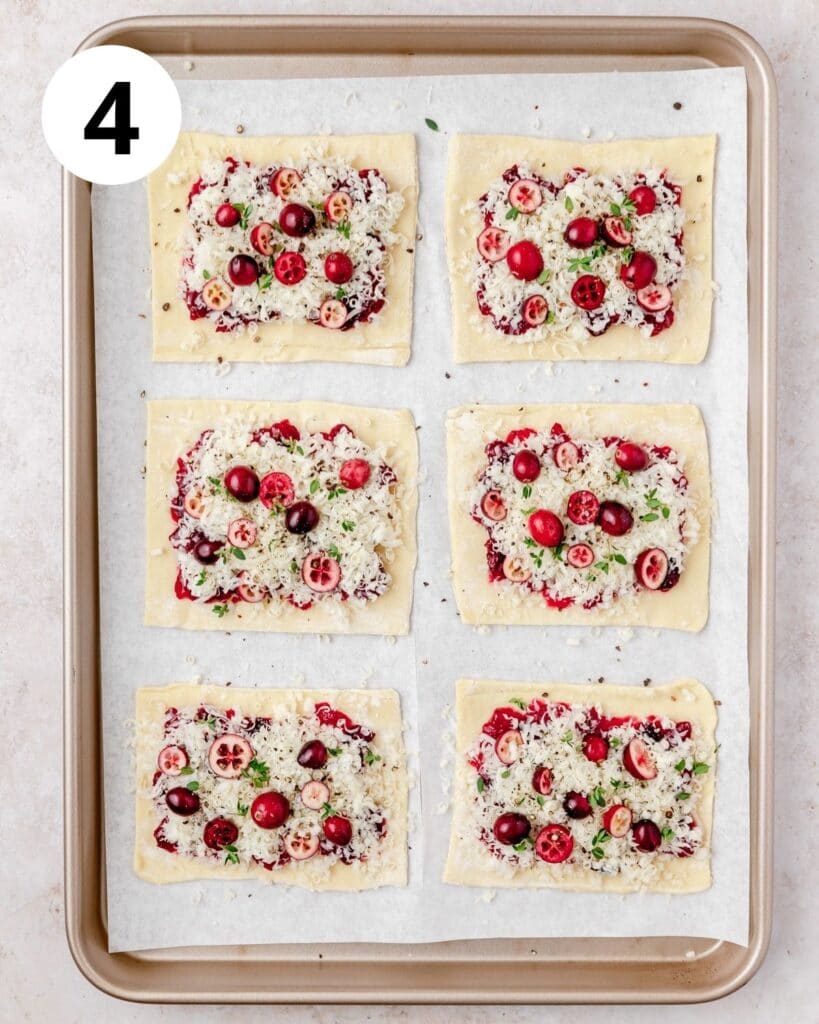 adding cranberries and thyme to tarts