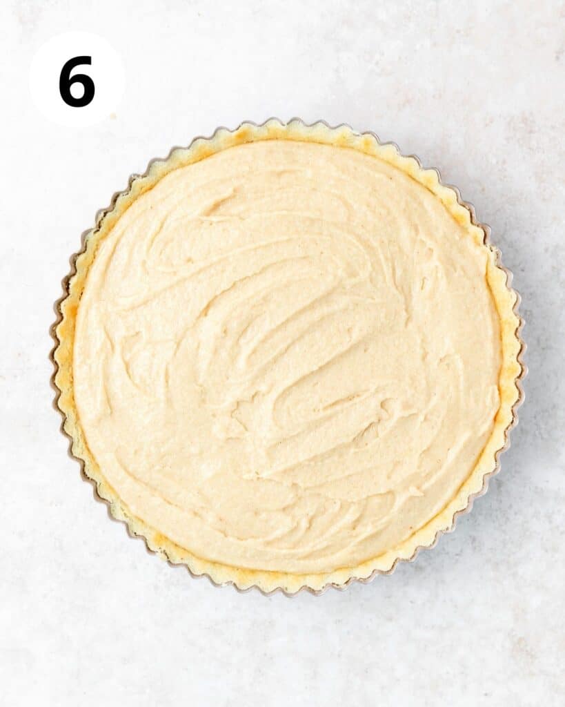spreading almond cream on top