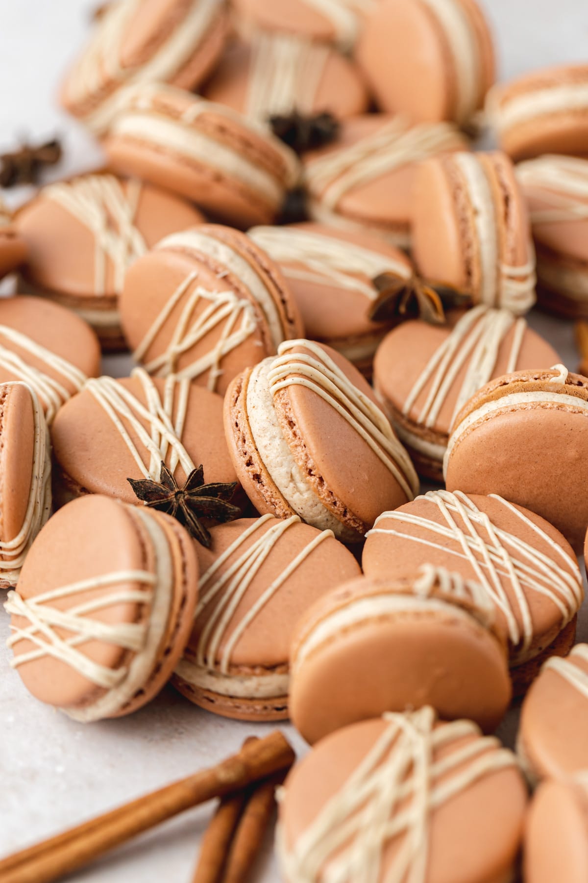 chai macarons with chai drizzle on top