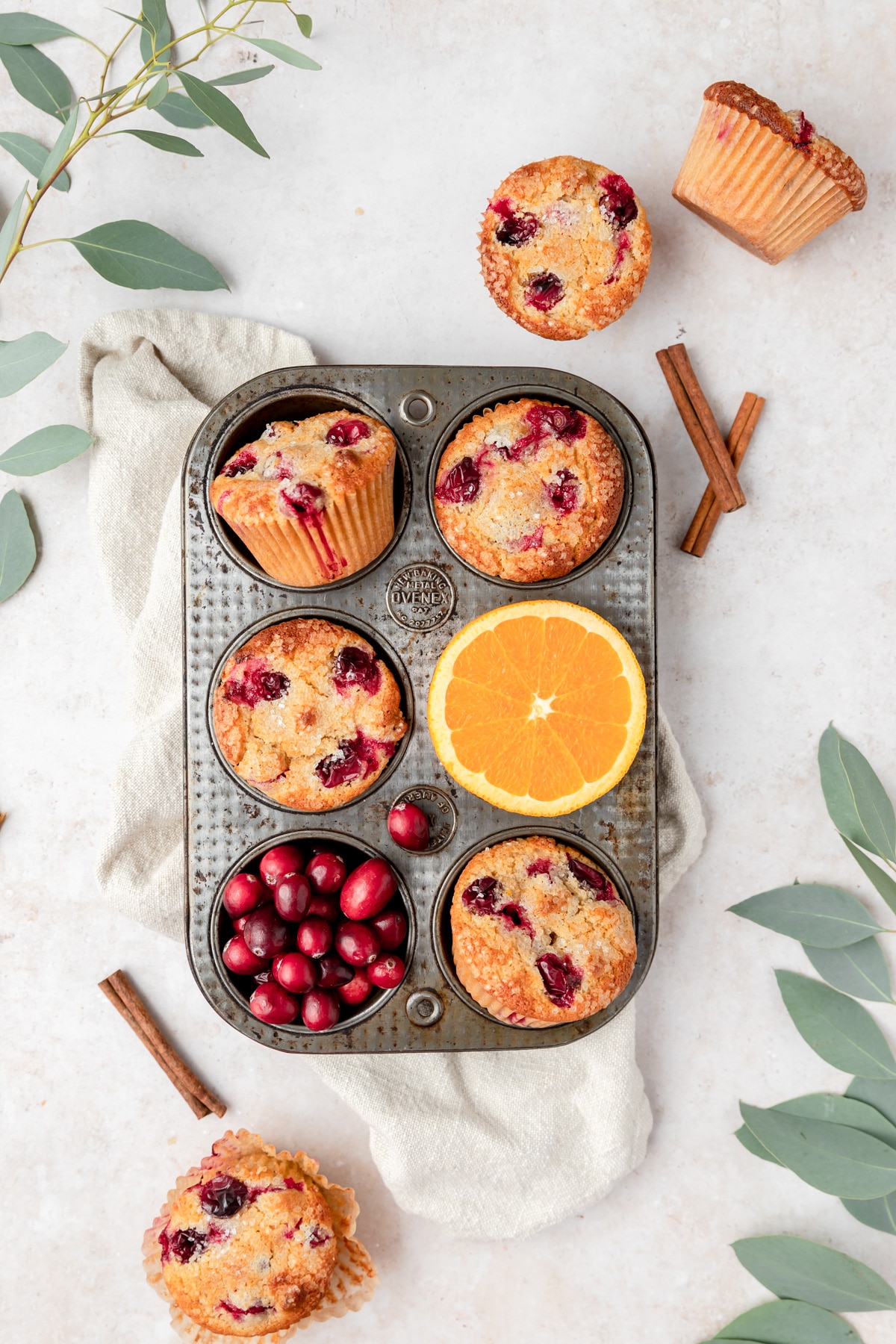 cranberry orange muffins in old baking tin