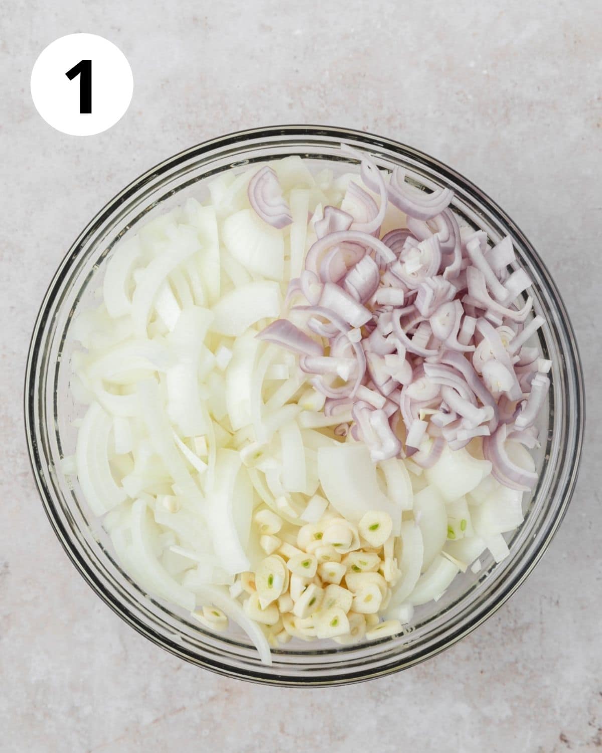 sliced onions and shallots in bowl