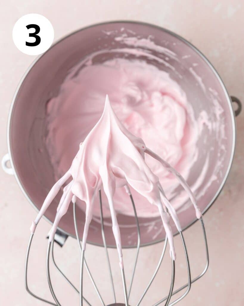 pink meringue whipped to stiff peaks.