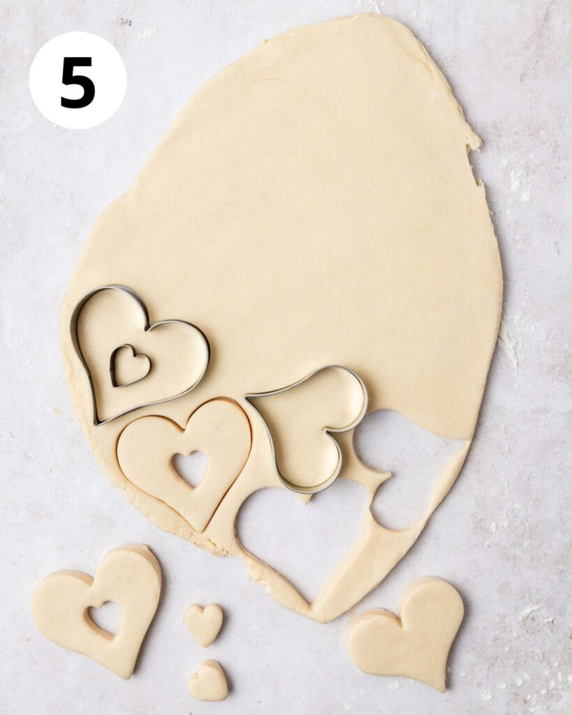 cutting out heart shaped donuts.