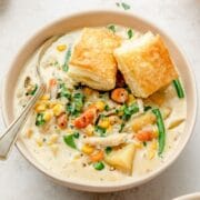 close up shot of chicken pot pie soup with puff pastry bites