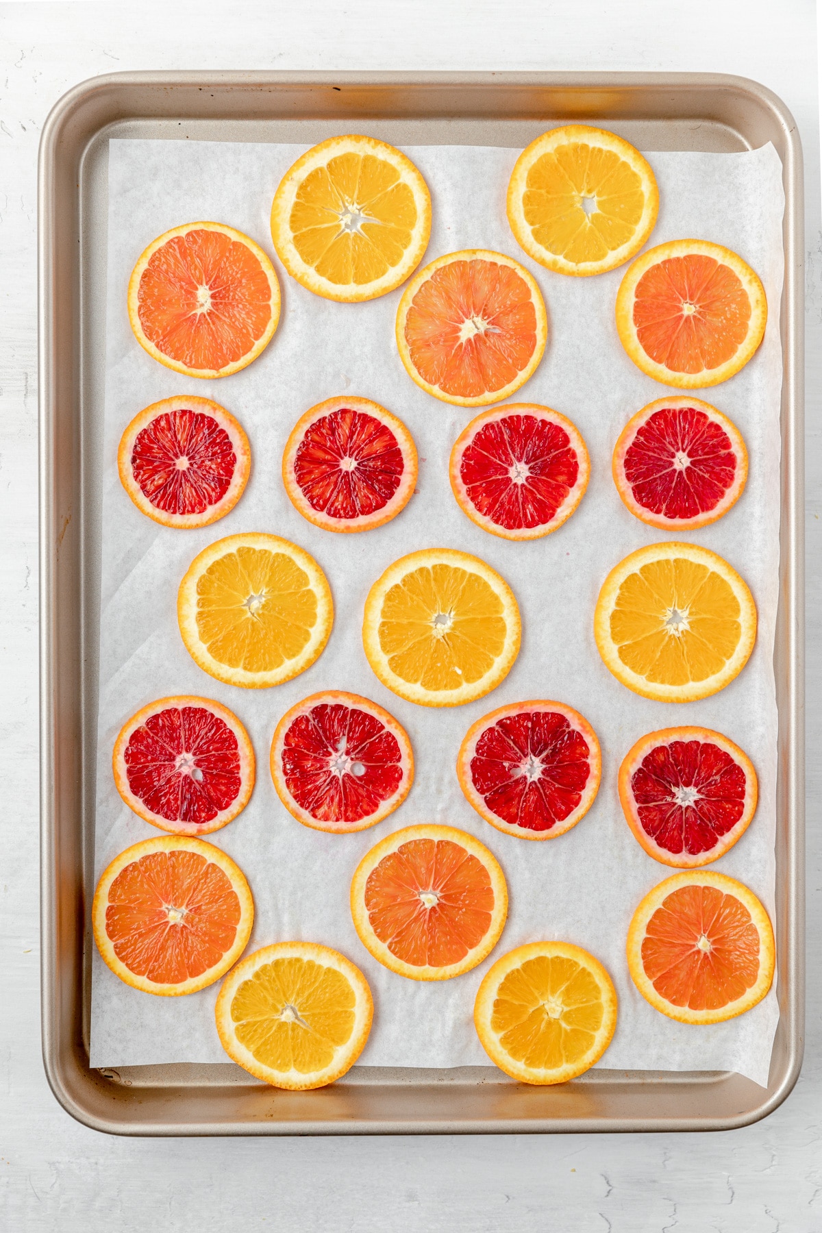 sliced oranges on baking sheet