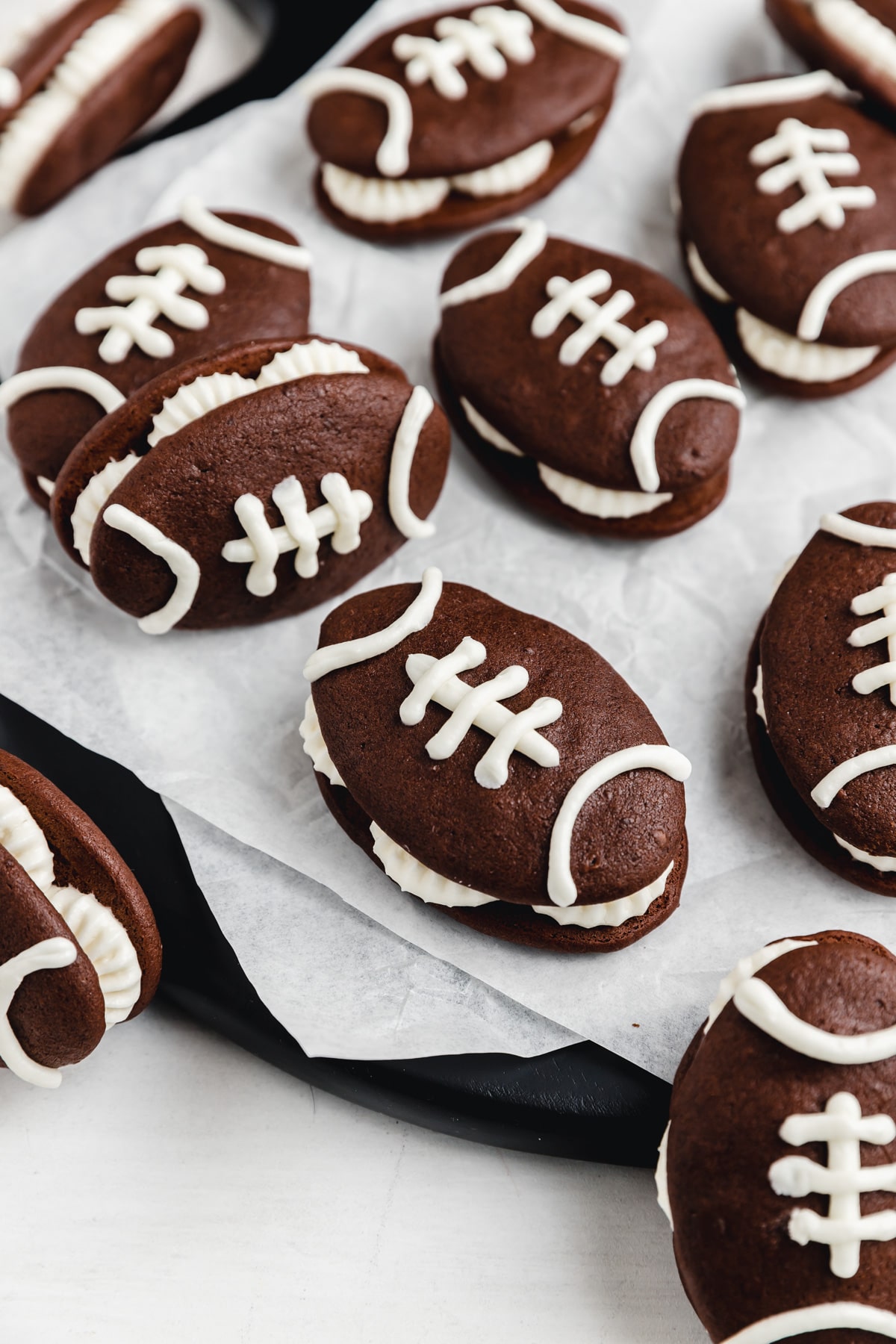 chocolate football shaped whoopie pies with marshmallow fluff