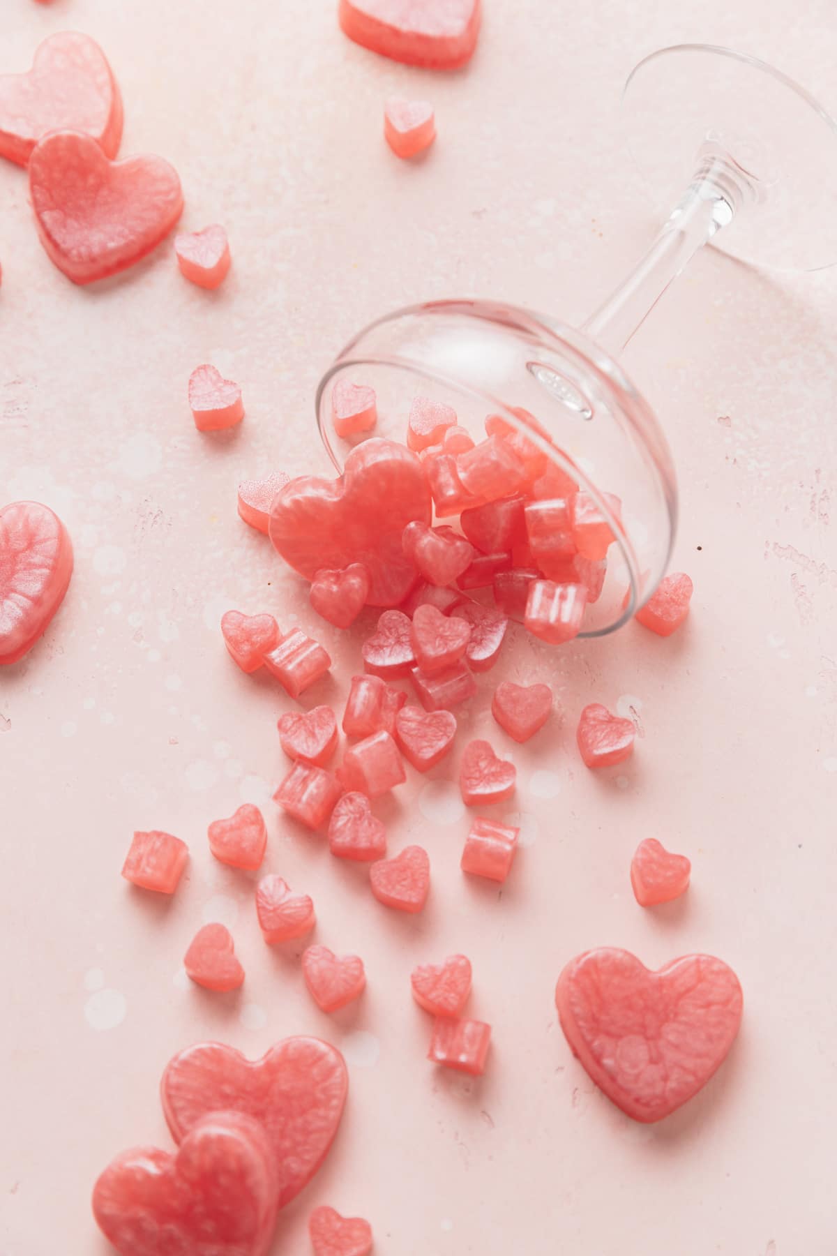 rosé gummies pouring out of wine glass