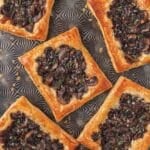 close up of mushroom tarts with gruyere