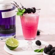 close up shot of blackberry lavender london mule cocktail with empress gin.
