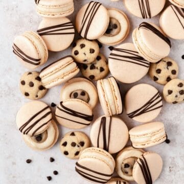 close up shot of chocolate chip cookie dough macarons.