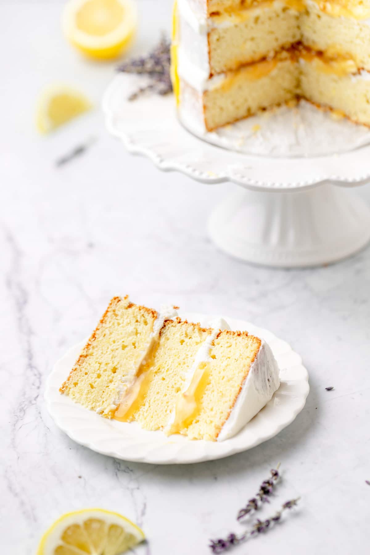 slice of lemon lavender layer cake on plate.