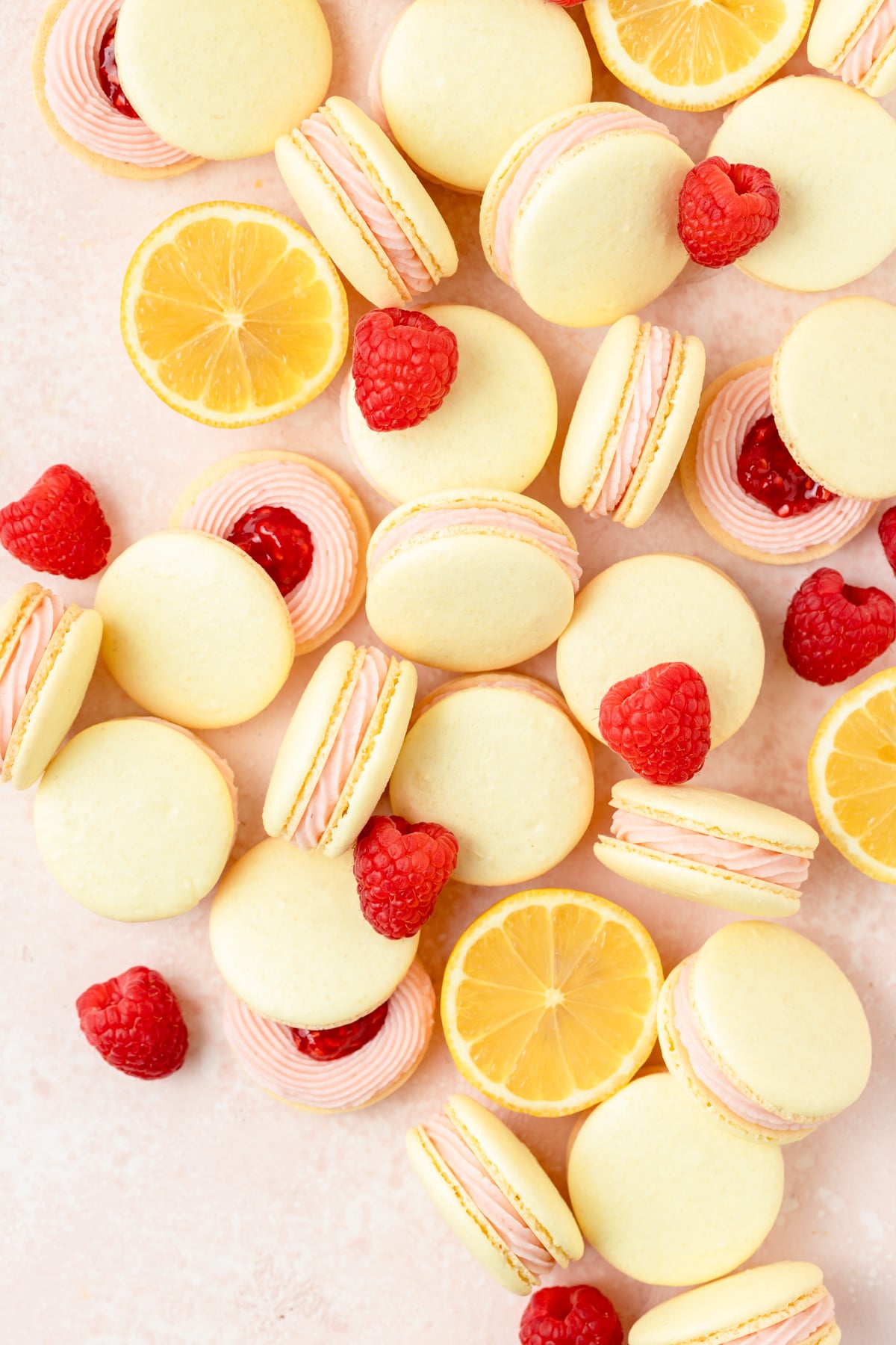 lemon macarons with raspberry filling and mascarpone frosting.