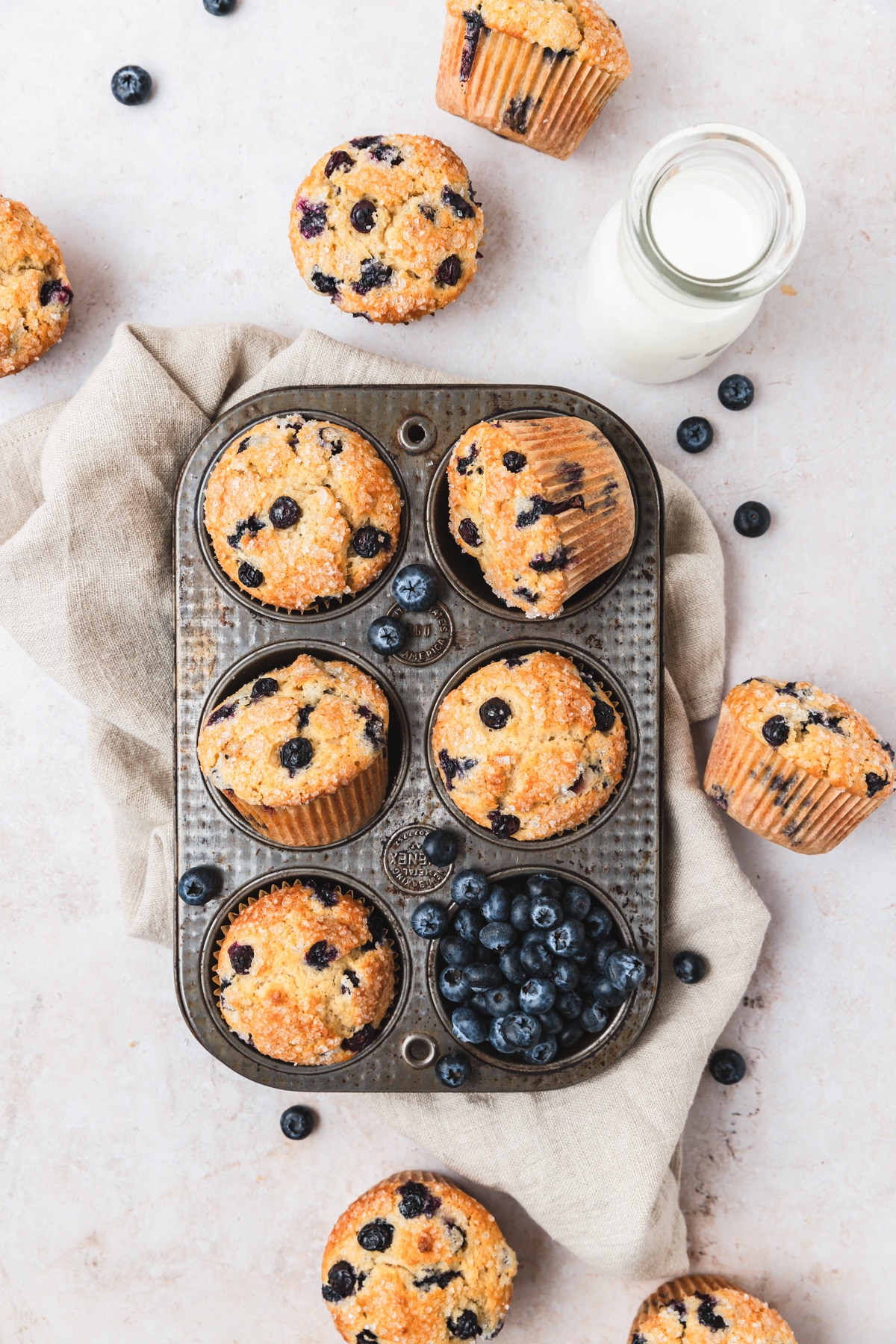 sourdough blueberry muffins in muffin tin.
