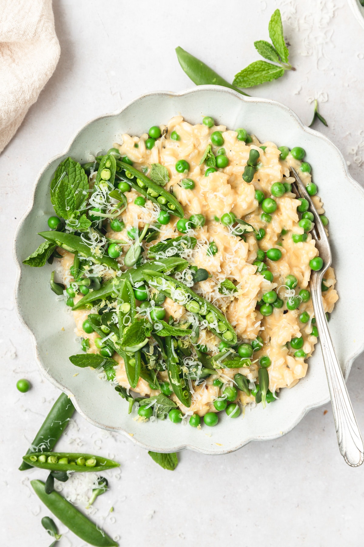 creamy spring pea risotto topped with microgreens.