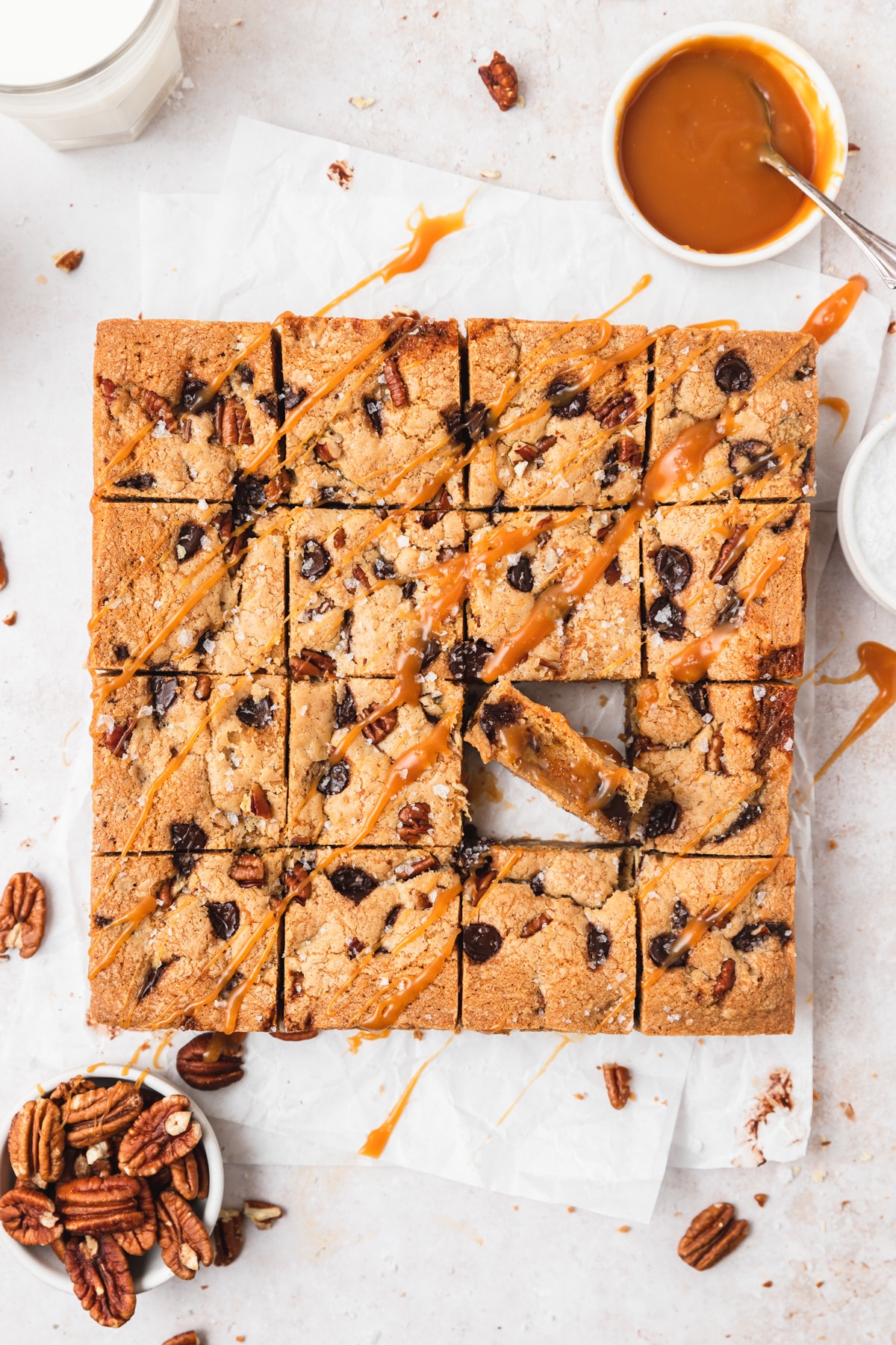 brown butter turtle blondies with salted caramel cut into squares.