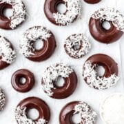close up shot of baked chocolate coconut donuts.