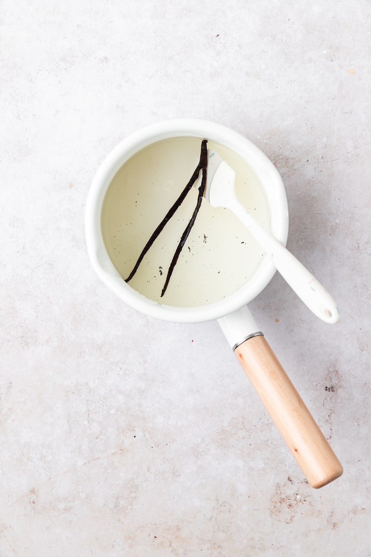 vanilla bean simple syrup in pot.