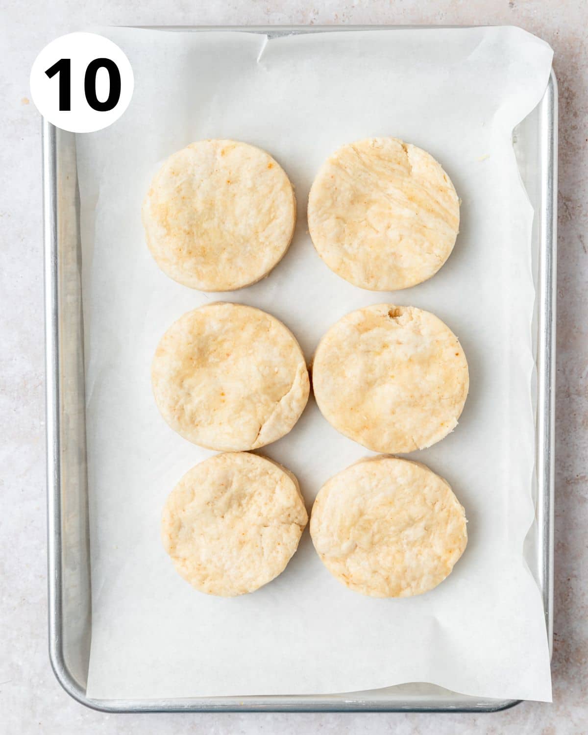 6 biscuits on baking sheet before baking.