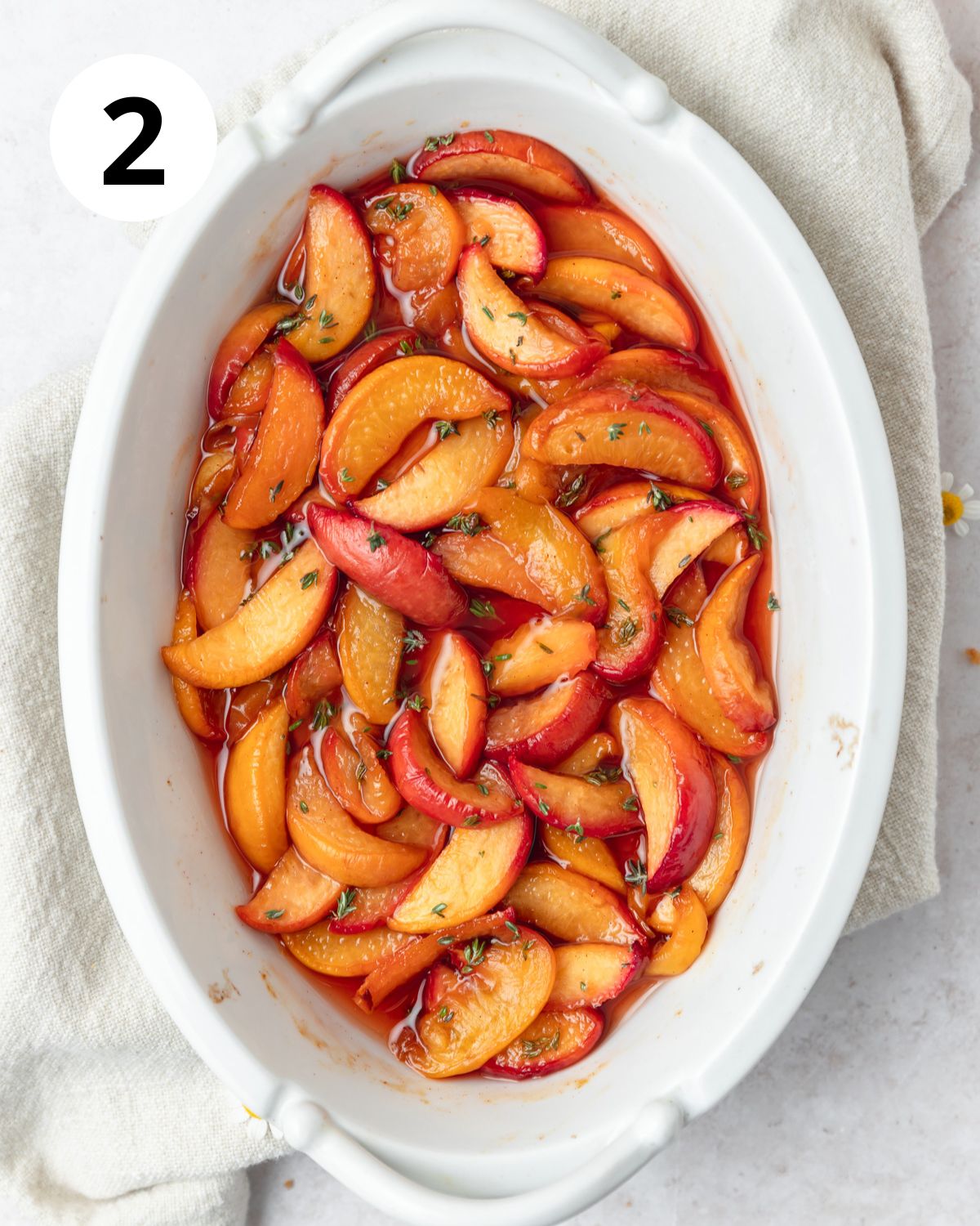 bourbon roasted peaches in baking dish.