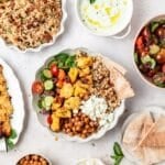 close up of greek chicken bowls with pearl couscous.