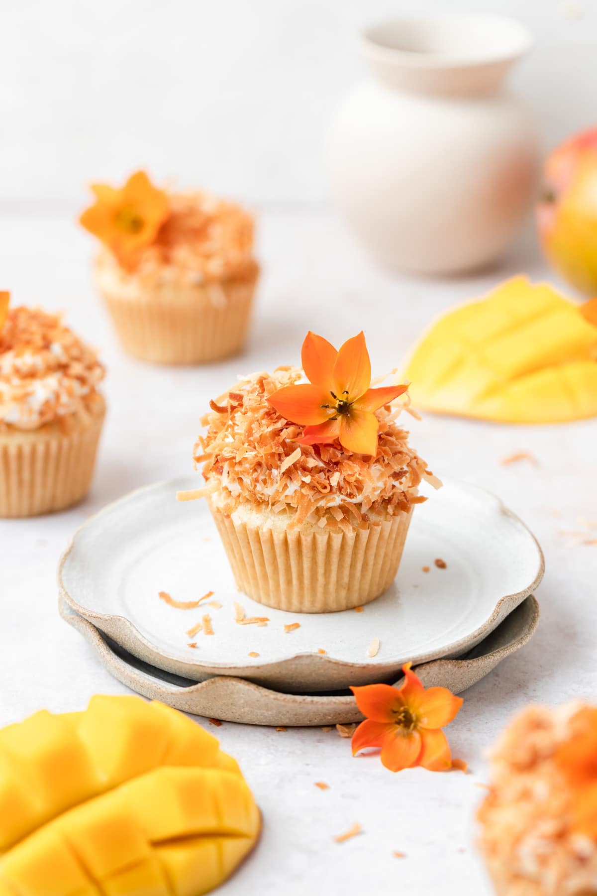mango coconut cupcakes filled with mango curd.