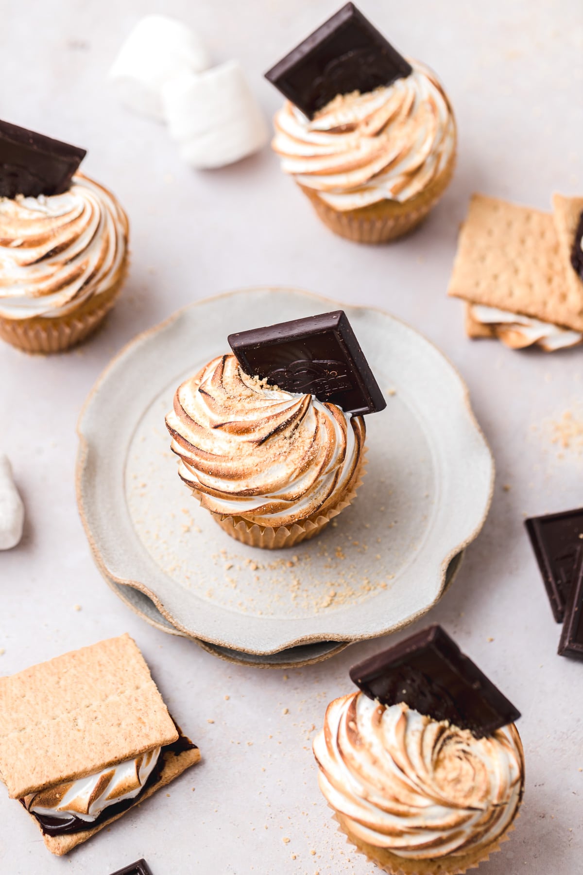 tops of toasted meringue smore cupcakes.