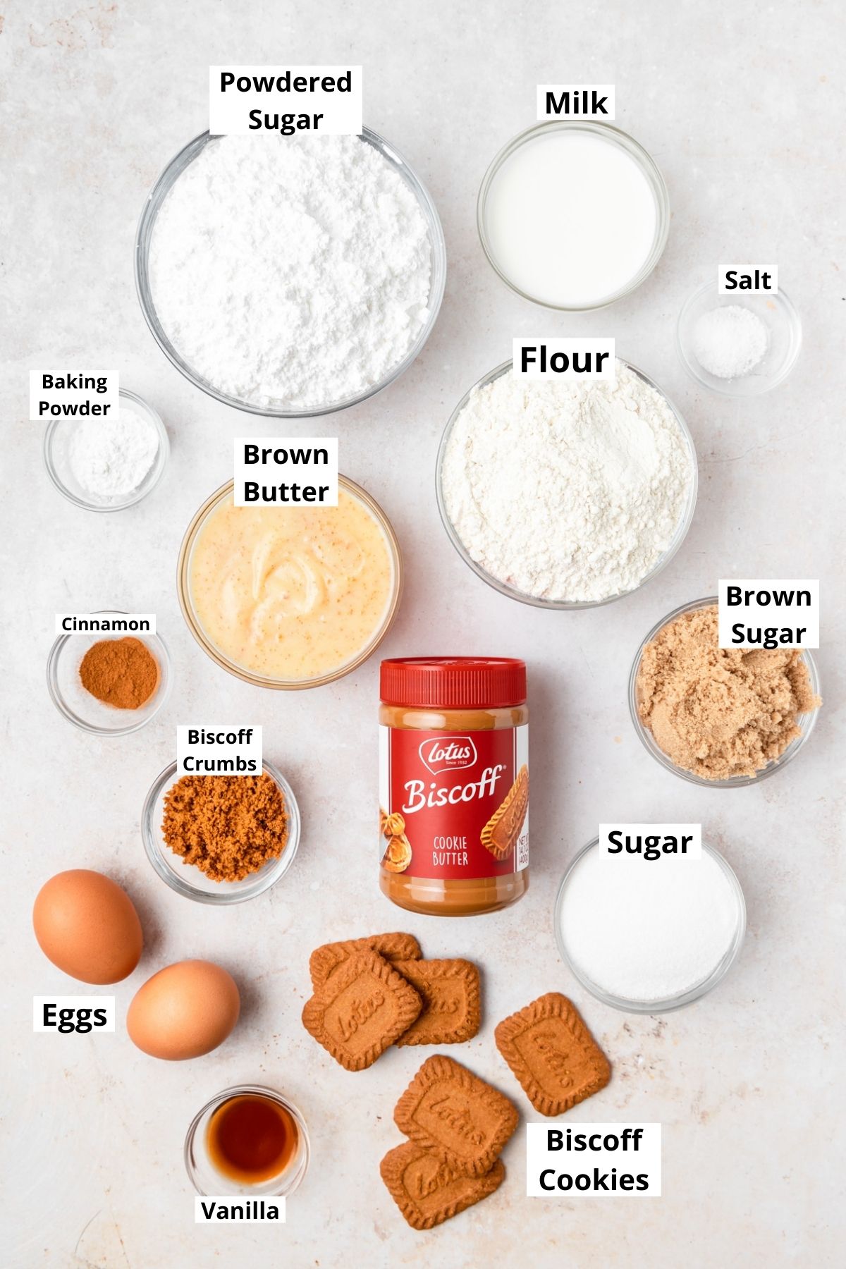 labeled shot of ingredients for biscoff cookie butter cupcakes.