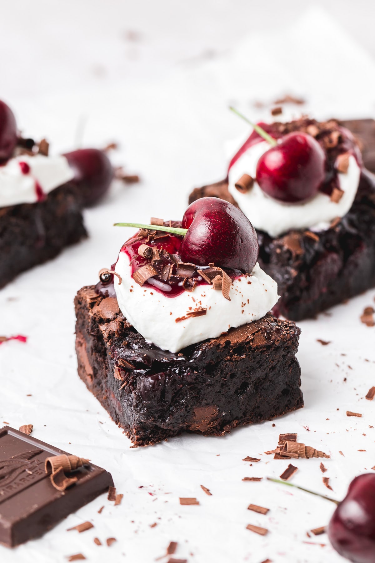 black forest brownies with cherry sauce and whipped cream.