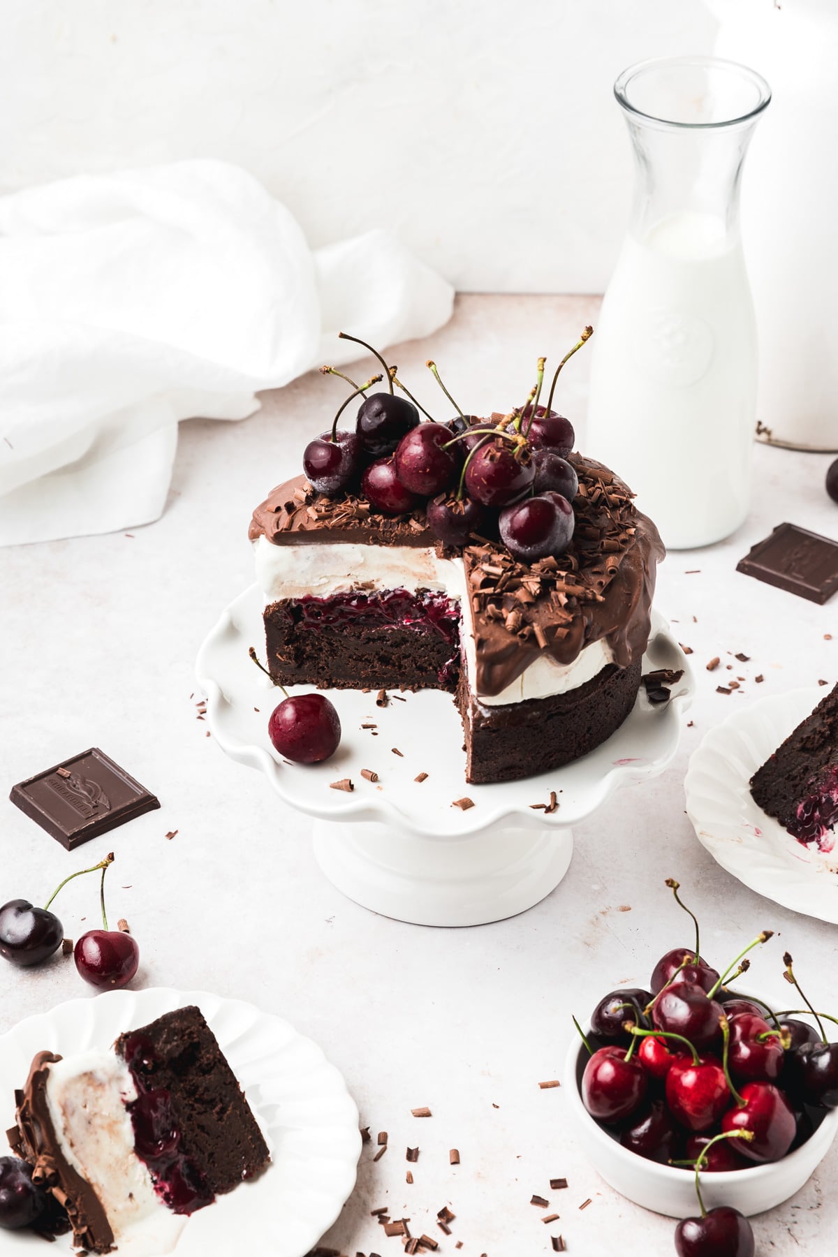 black forest ice cream cake with cherries and vanilla ice cream.