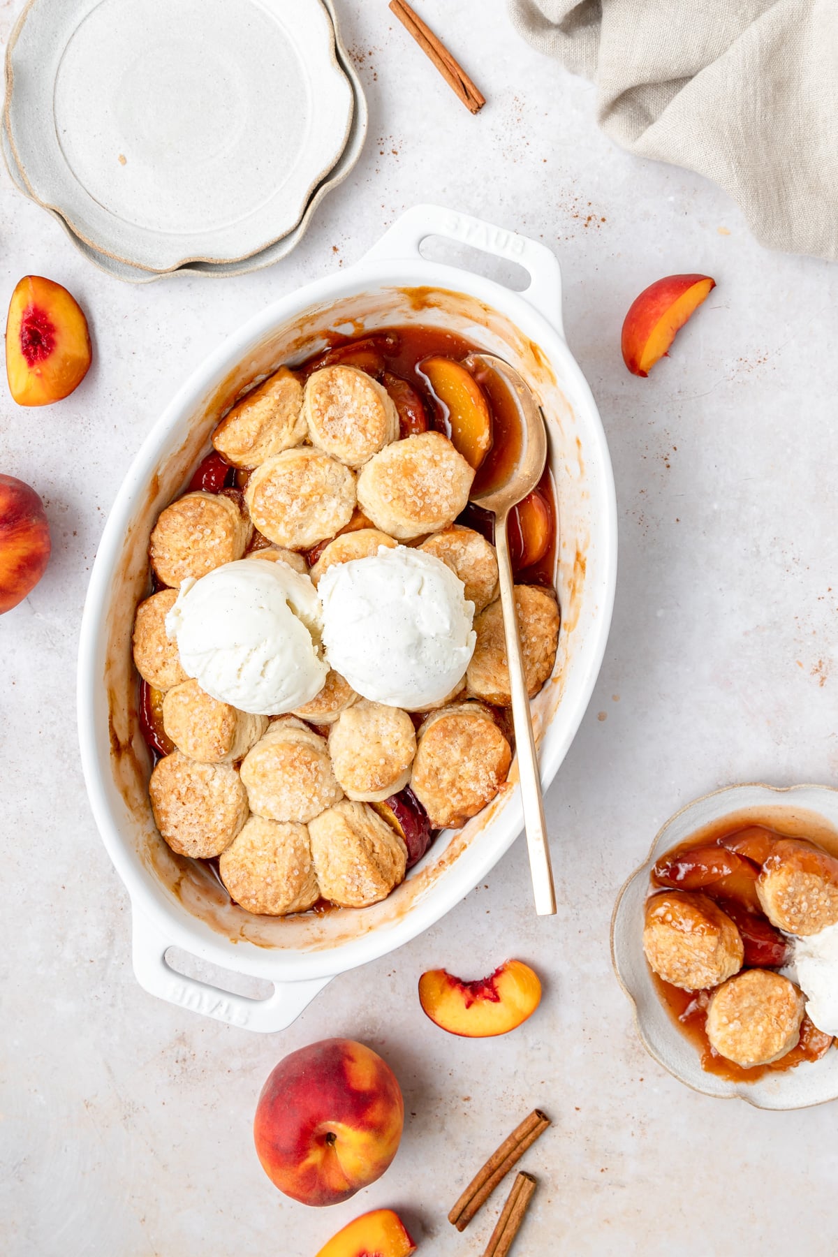 peach cobbler with cream biscuit topping.