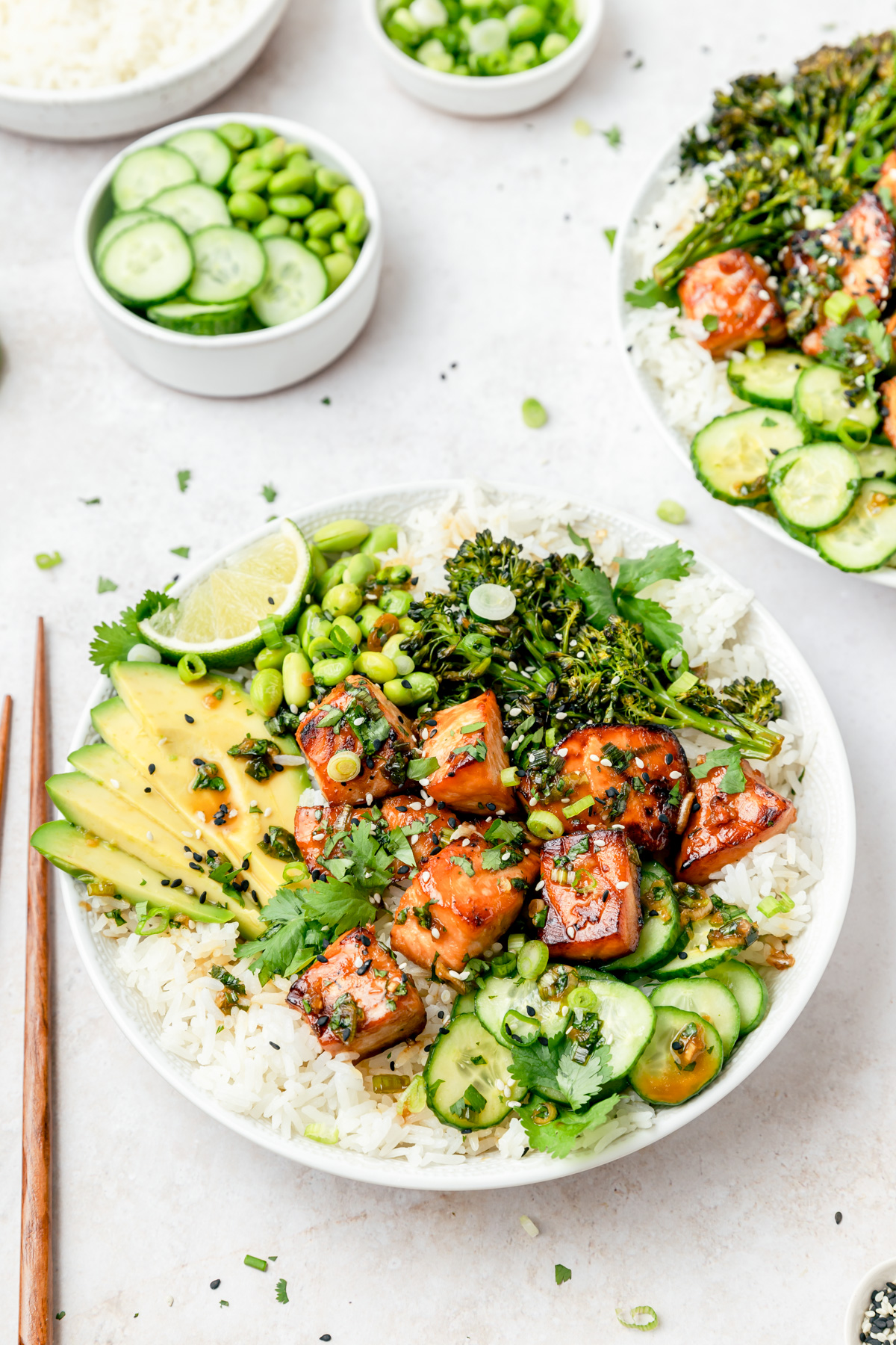 salmon rice bowls with avocado and greens.