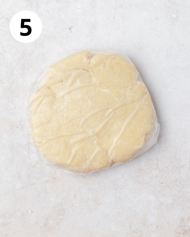flattened disc of cheesy pie dough before chilling.