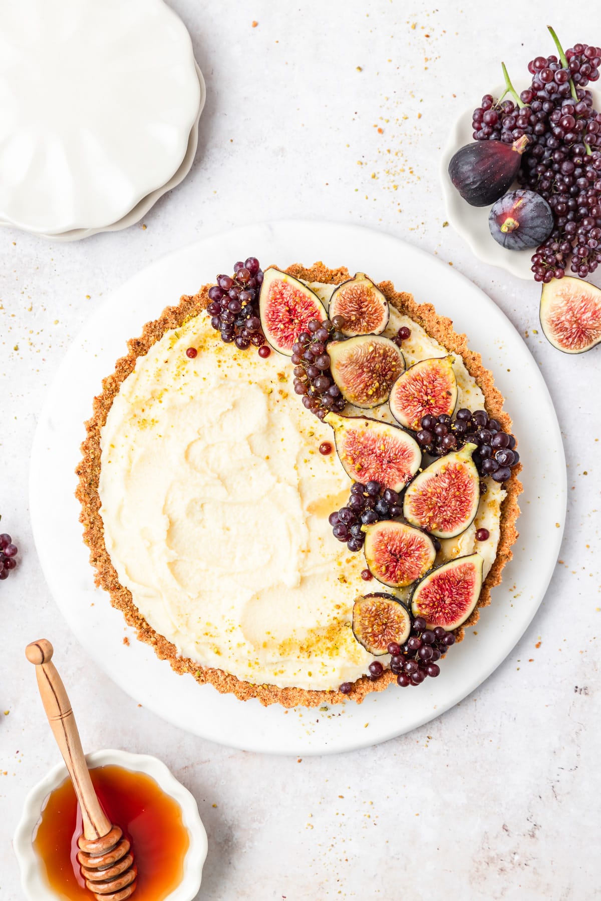 fig mascarpone tart with honey and champagne grapes.