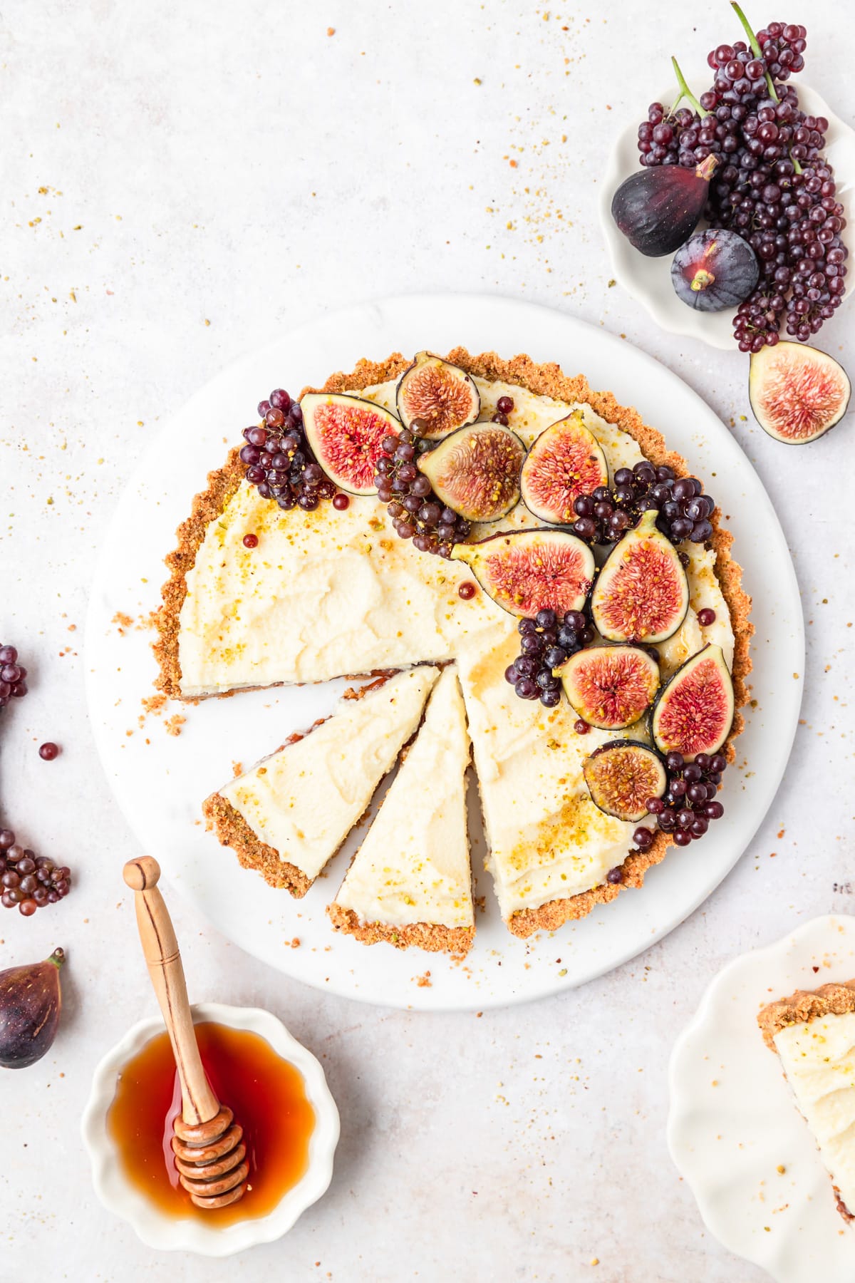 fig mascarpone tart with fig jam cut into slices.