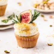 close up shot of fig olive oil cupcakes with mascarpone frosting.