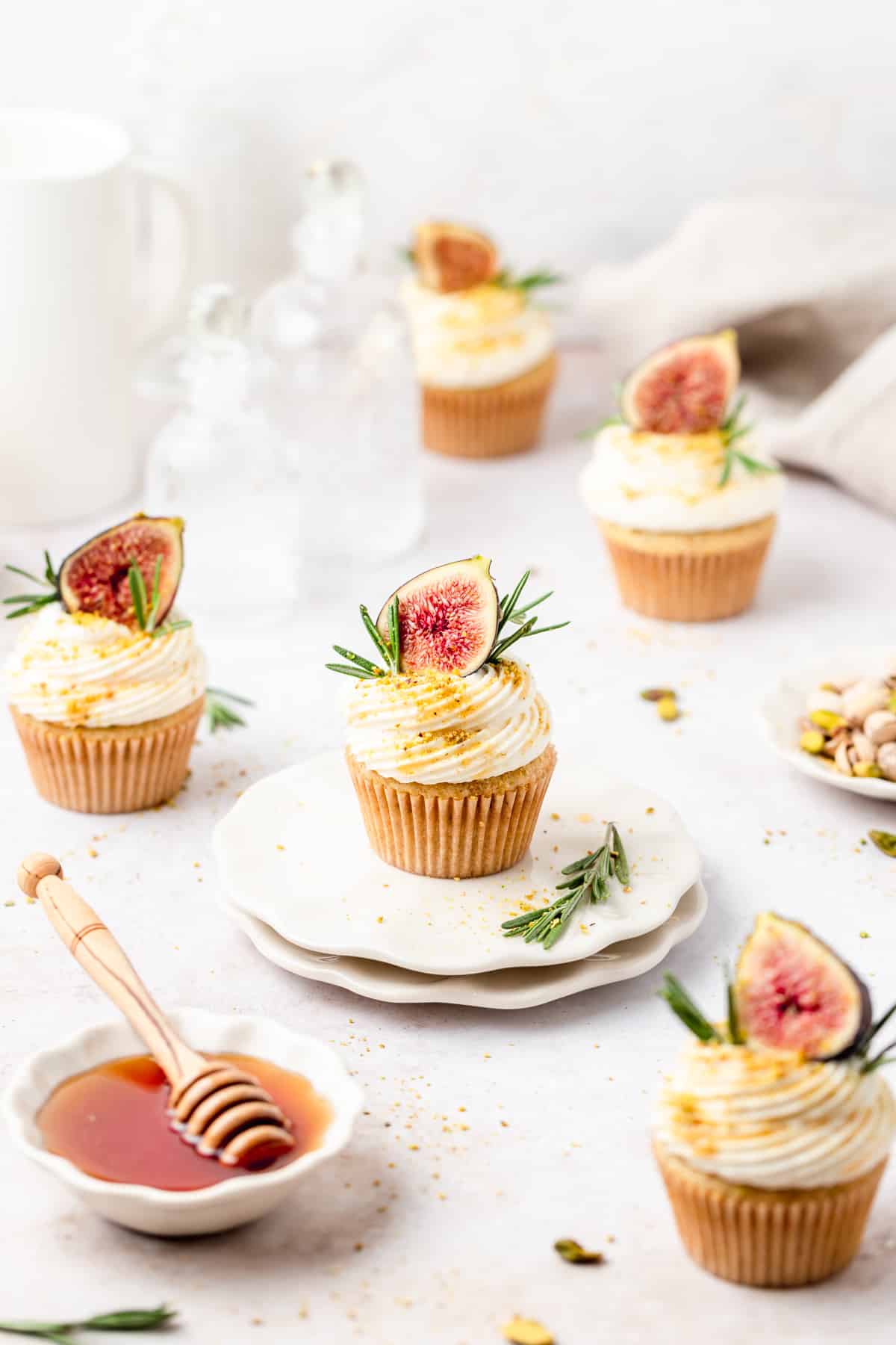 fig olive oil cupcakes topped with fresh figs, rosemary, and honey.