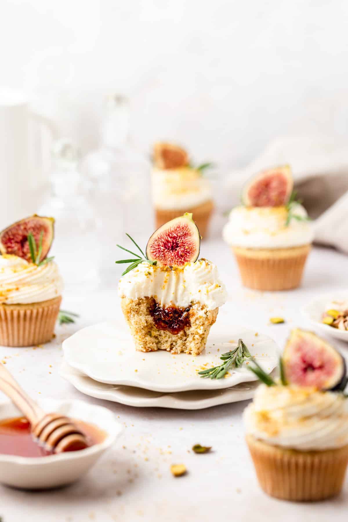 fig olive oil cupcakes with pistachios and rosemary filled with fig jam.