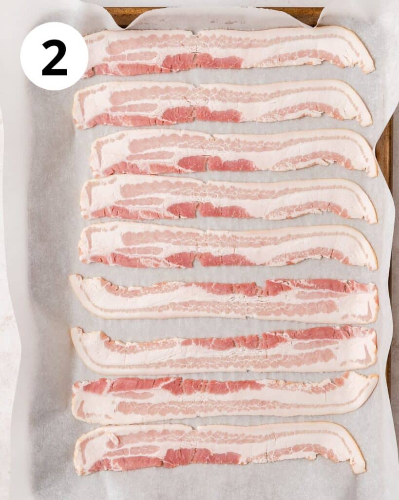 thin cut bacon on baking sheet.