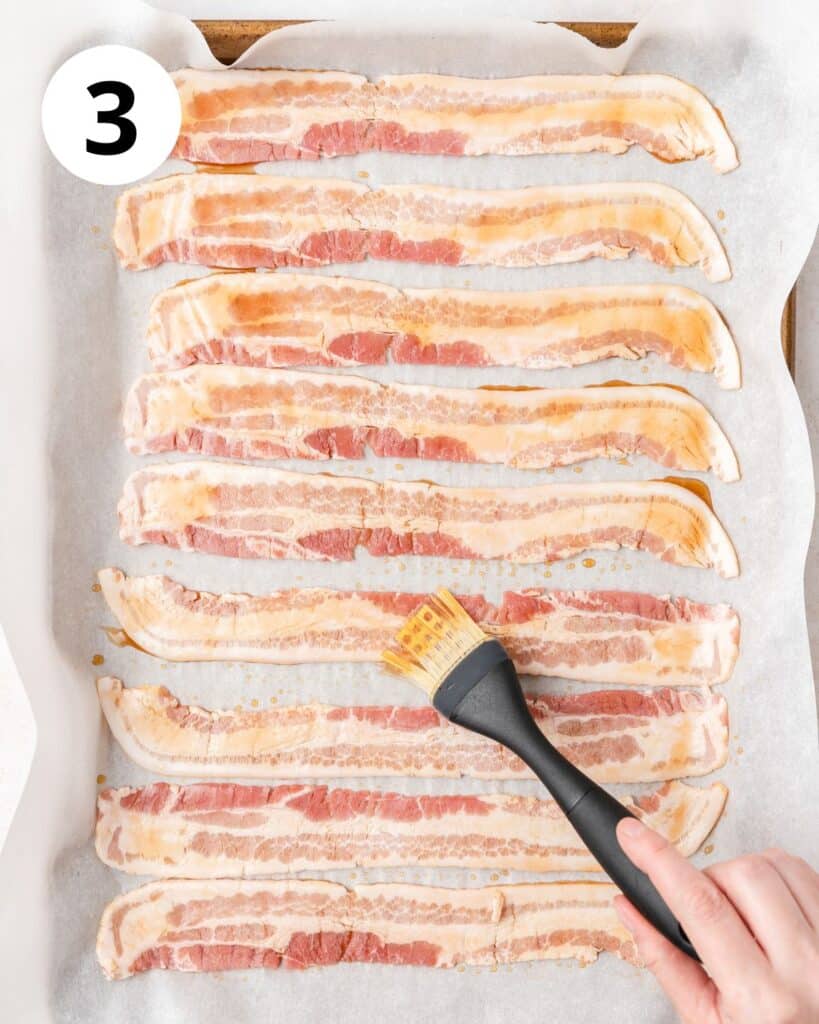 brushing bacon with bourbon and maple syrup.