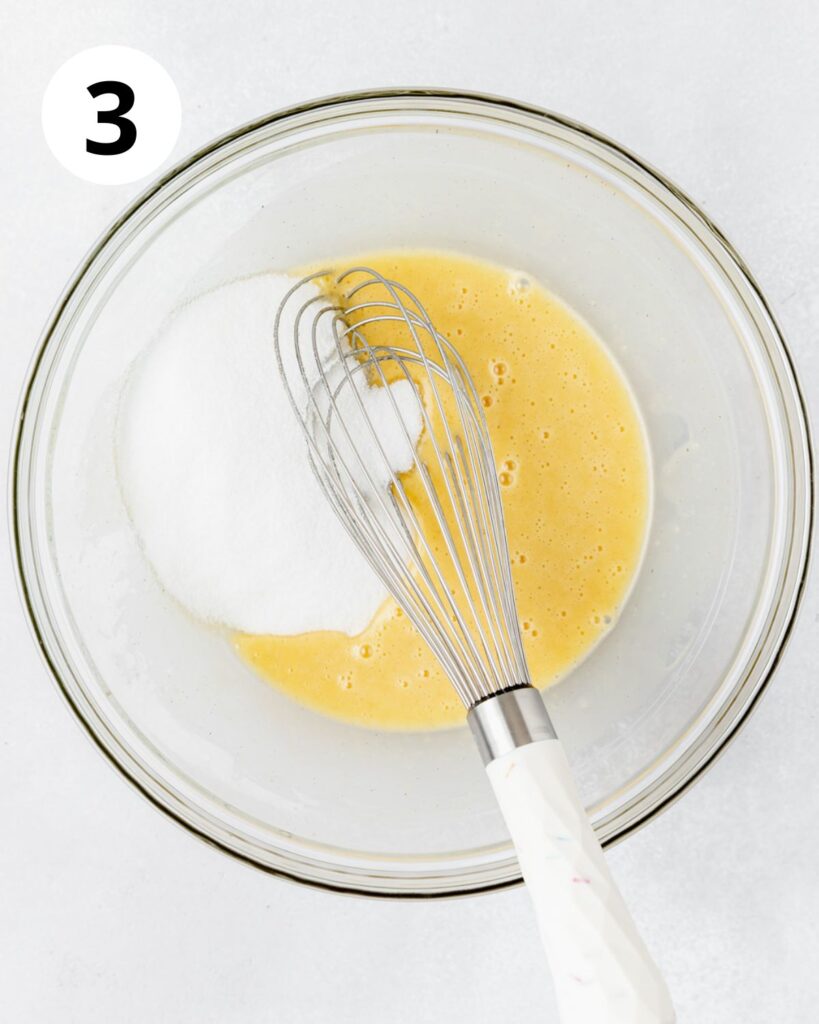 whisking sugar into eggs and oil.
