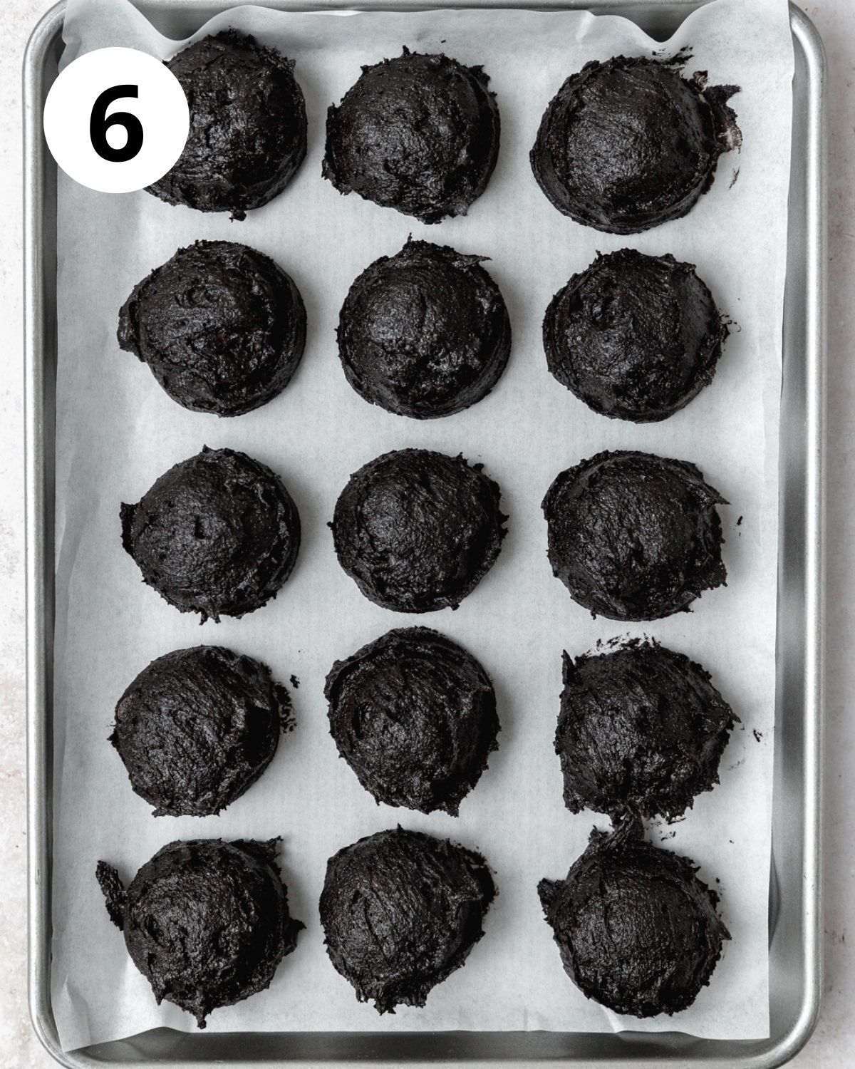black cocoa cookie dough balls before baking.