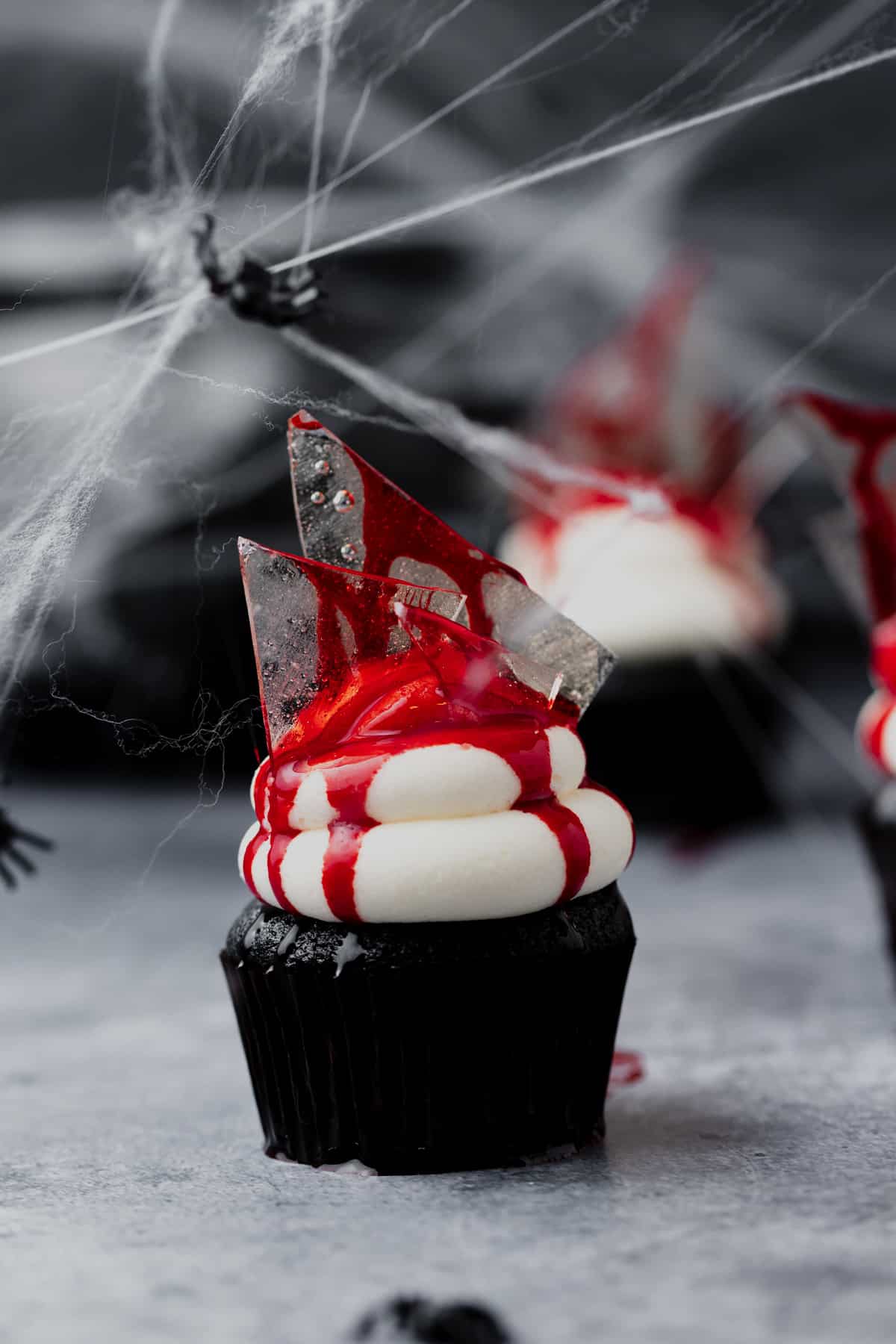 halloween bloody broken glass cupcake with white chocolate frosting.