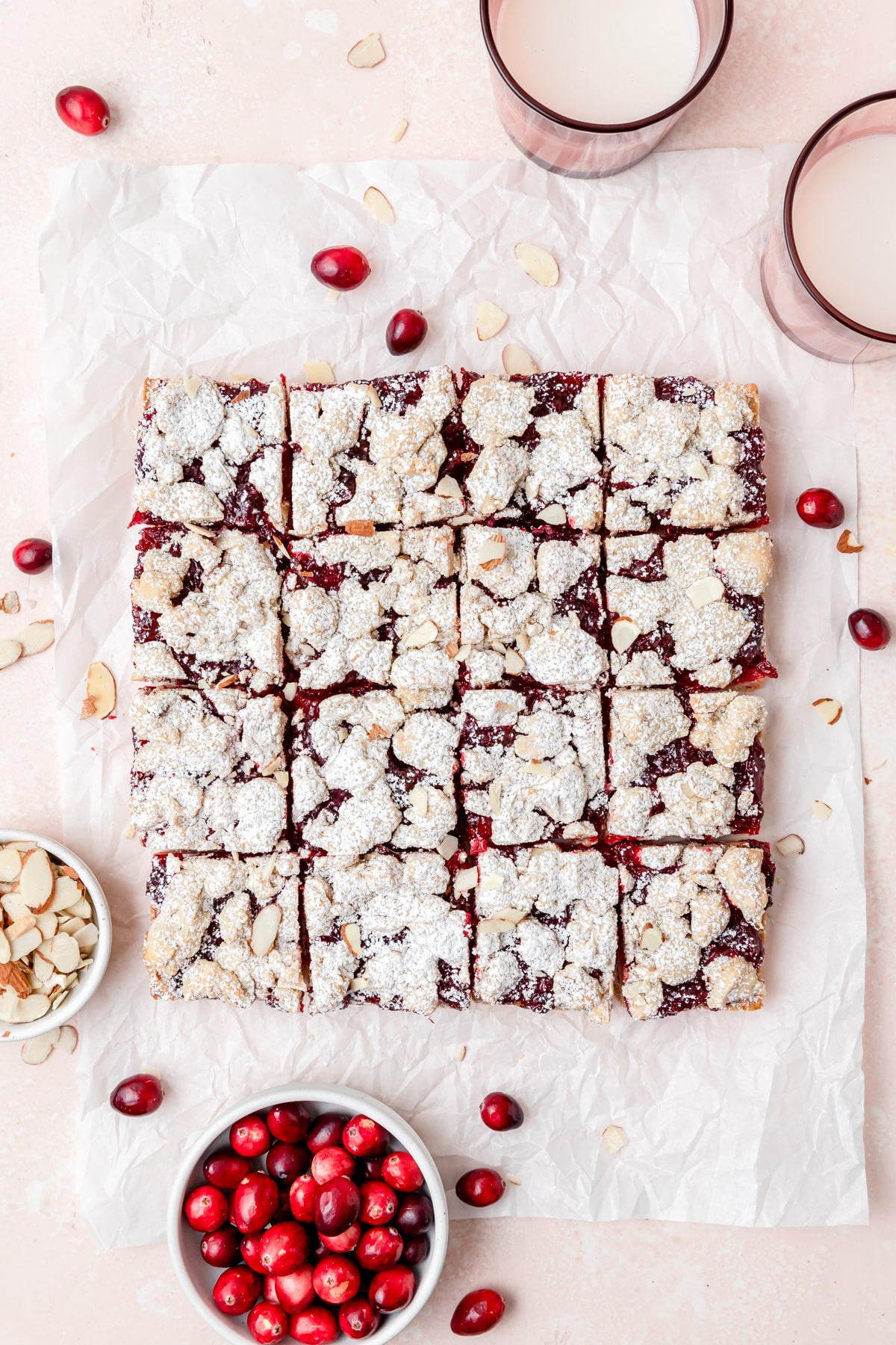 cranberry crumble bars after baking with powdered sugar dusted on top.