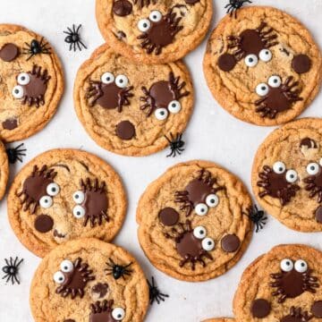 close up shot of spider pumpkin chocolate chip cookies.