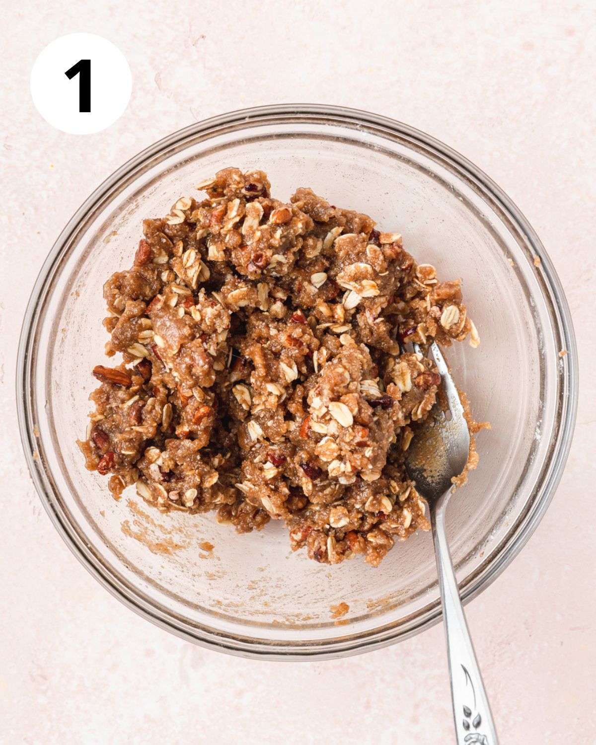 mixing together oat and pecan crisp topping.