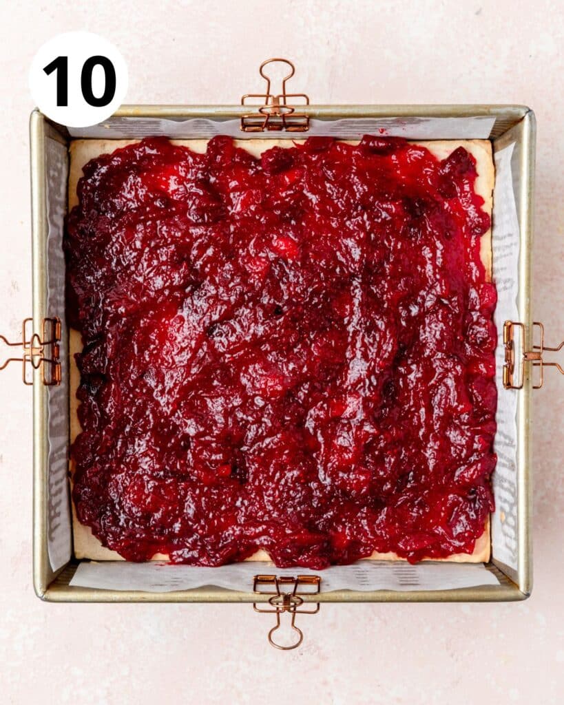 smoothing cranberry sauce into even layer.