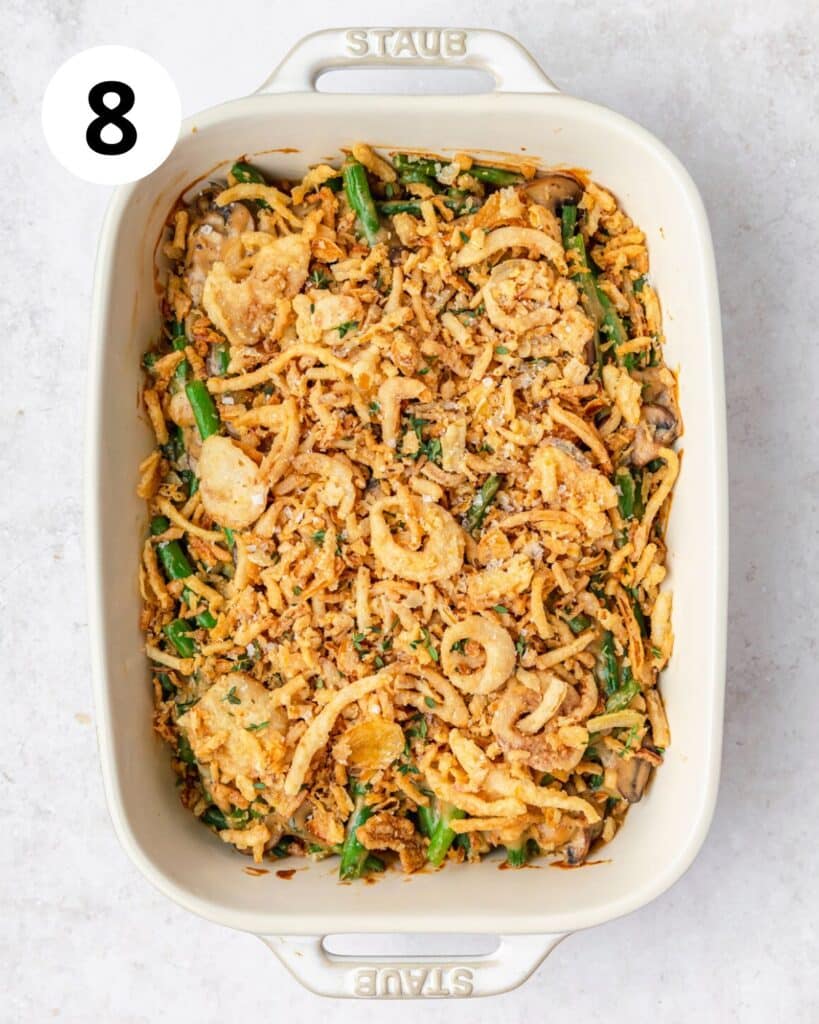 topping green bean casserole with french fried onions.