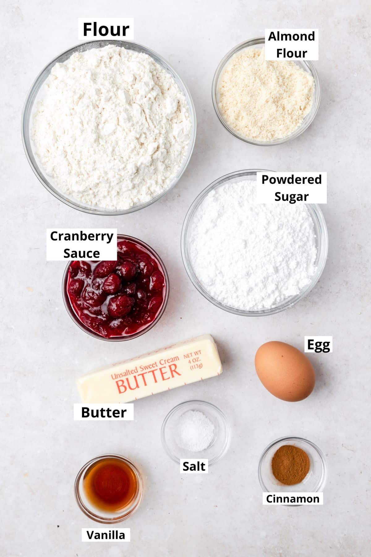 labeled ingredients for cranberry linzer cookies.